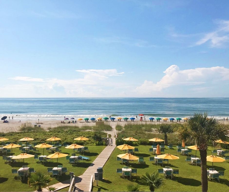 View of the oceanfront yellow umbrellas at Dayton House