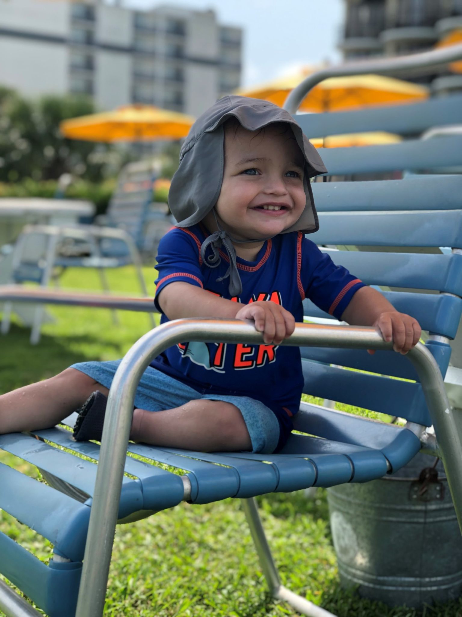 baby smiling on chair