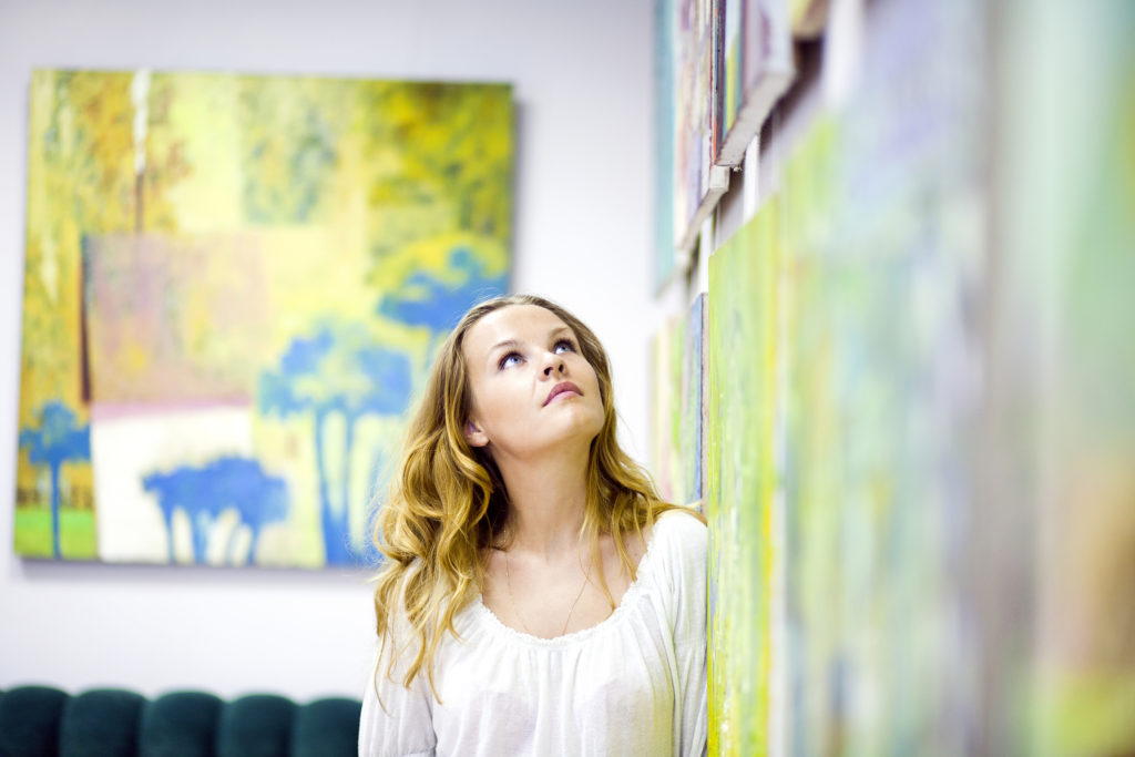 a woman gazing at artwork at the chapin art museum in myrtle beach