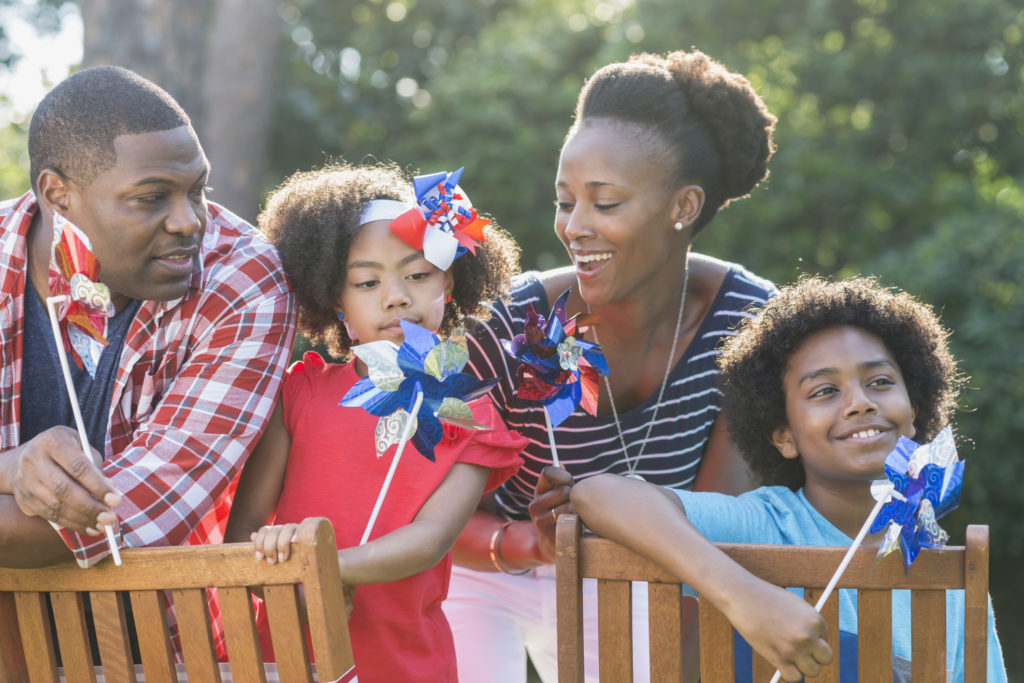 an african american family celebrating july 4th in myrtle beach